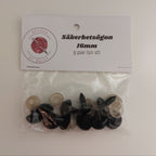 Svarta säkerhetsögon i olika storlekar